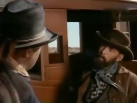screencap of Prophet Satterlee next to an Old West stage coach